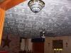 Remove the cost of asbestos ceilings, by gluing Styrofoam ceiling tiles over existing surface. 